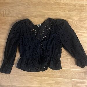 Black eyelet top with floral cutouts